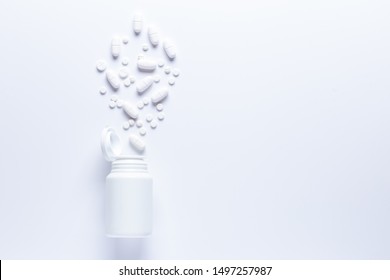 Spilled Pill Bottle Isolated.Top View,
Pharmacology Concept. White Pills .