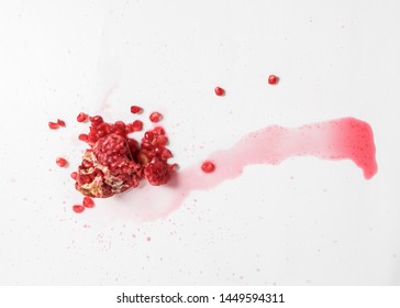 Spilled Pomegranate Red Wine On White Background