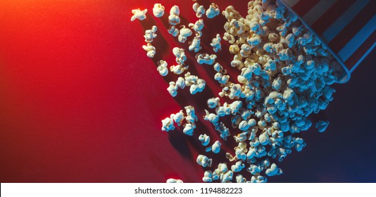 Spilled popcorn on a red background, cinema, movies and entertainment concept - Powered by Shutterstock