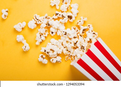 spilled-popcorn-on-yellow-background-260