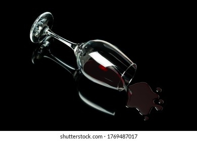 Spilled Wine Glass On A Black Background With Reflection. Alcohol Abuse Concept.