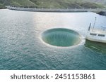 spillway near a dam to prevent overflowing water