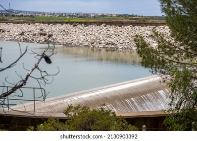 The Spillway From The Reservoir. Water Overflows Over The Edge Of The Dam. Heavy Rains Cause Water To Rise On The Dams.