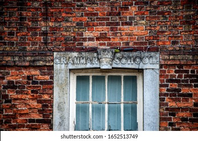 SPILSBY, LINCOLNSHIRE / UK - Circa JUNE 2019: Closeup Of Windows Of Brick Built Grade II Listed King Edward VI Grammar School In Bad State Of Repair