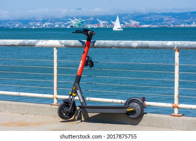 Spin Scooter Electric Rideshare E-scooter S-100 Parked On Scenic Waterfront. Spin Is A Bicycle-sharing And Scooter-sharing Company Owned By Ford Motor Company. - San Francisco, California, USA - 2021