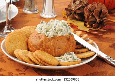 Spinach Artichoke Parmesan Dip In A Bread Bowl With Crackers