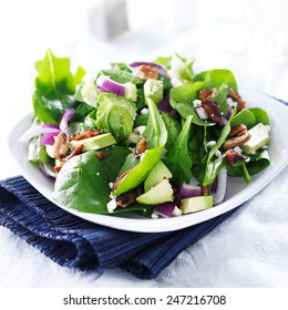 Spinach And Avocado Salad On White Plate