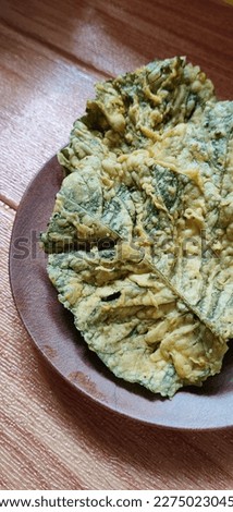 spinach chips on a plate, look like noised with spinach chips