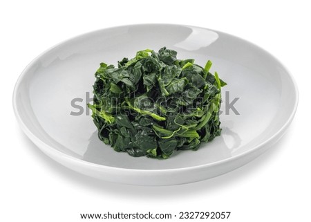 Spinach cooked in white dish isolated on white with clipping path included 