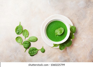 Spinach Cream Soup In Bowl Decorated Spinach Leaves Top View.