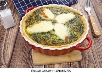 spinach and mozzarella pie on a table