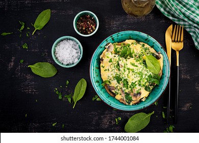 Spinach And Mushroom Omelette. Frittata Made Of Eggs, Mushrooms And Spinach. Italian Cuisine. Top View, Flat Lay, Copy Space