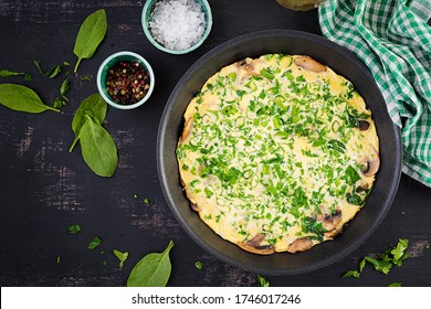 Spinach And Mushroom Omelette. Frittata Made Of Eggs, Mushrooms And Spinach. Italian Cuisine. Top View, Flat Lay, Copy Space