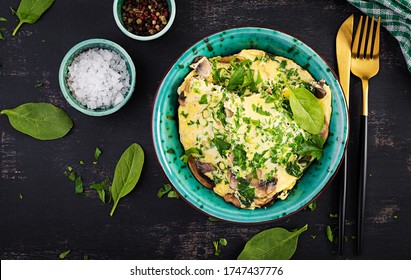 Spinach And Mushroom Omelette. Frittata Made Of Eggs, Mushrooms And Spinach. Italian Cuisine. Top View, Flat Lay, Copy Space