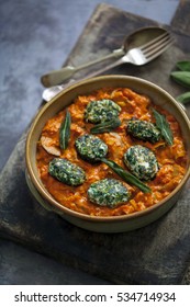 Spinach And Ricotta Dumplings In Tomato And Courgette Sauce