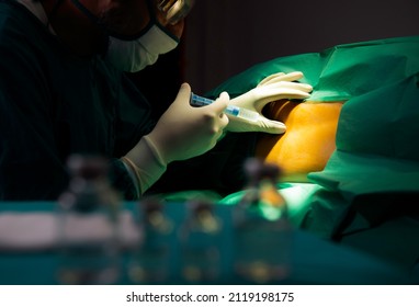 Spinal nerve block. Epidural anesthesia to pregnant woman preparation for pain relief of active labour and caesarean section, Anesthesia prepares for surgery, medical history.  - Shutterstock ID 2119198175