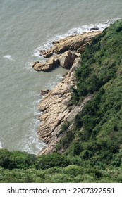 Spindrift and rocks by the sea, photo in Taizhou, Zhejiang, China. - Shutterstock ID 2207392551