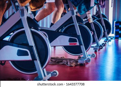 Spinning class, group activity on stationary bike. Team cardio excercise on bicycle. - Powered by Shutterstock