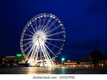 Spinning Ferris Wheel At Twilight