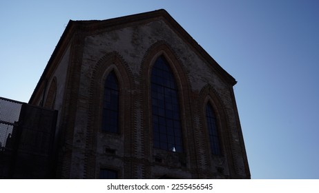 Spinning mill, industrial late medieval building. Lombard neo-Gothic style, built in 1872. Located in Martinengo (Bergamo province). Winter shots - Shutterstock ID 2255456545