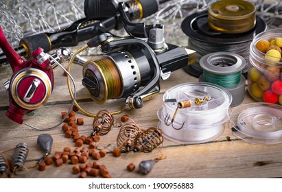 Spinning rods and reels for fishing, on an old background. - Shutterstock ID 1900956883