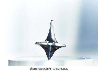 Spinning Top. A Modern, Sleek, Engineering   Marvel. Backlit Metal On Metal