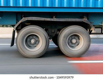 A Spinning Wheel Of A Truck Running On The Road. Detail Of A Rotating Wheel Of A Truck.