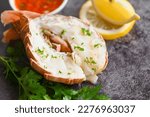 spiny lobster food on plate, fresh lobster or rock lobster seafood with herb and spices lemon coriander parsley lettuce salad, lobster for cooking food and seafood sauce 