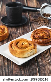 Spiral Apple Cake Or Muffin With Cup Of Fresh Coffee On Wooden Background