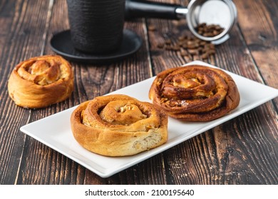 Spiral Apple Cake Or Muffin With Cup Of Fresh Coffee On Wooden Background