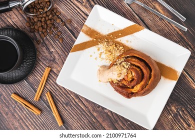 Spiral Apple Cake Or Muffin With Cup Of Fresh Coffee On Wooden Background