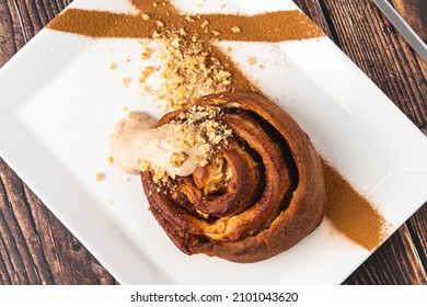 Spiral Apple Cake Or Muffin With Cup Of Fresh Coffee On Wooden Background