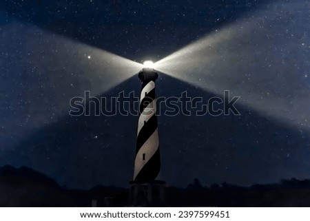 With its spiral black and white stripes, America’s tallest lighthouse, the Cape Hatteras Light on the North Carolina Outer Banks, shines brightly in a summer night sky full of stars.