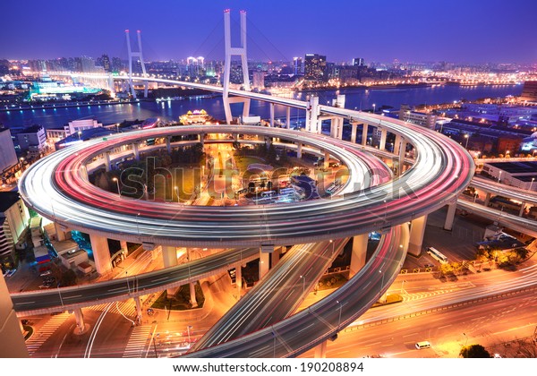 Spiral bridge in Shanghai Huangpu\
River on the bird\'s eye view of the beautiful night\
view