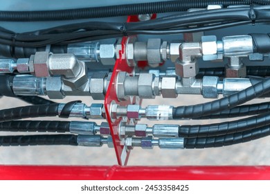 Spiral cable connecting truck cabin and trailer. Pneumatic hoses and electric cables on the coupler of the hitch between a tractor truck and its semi-trailer. Hydraulic control system in new cars. - Powered by Shutterstock