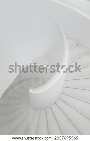 spiral grey white staircase with large copy space