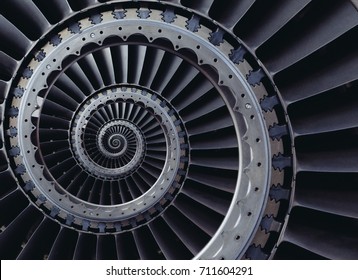 Spiral industrial production metallic turbine background. Turbine blades wings spiral effect abstract fractal pattern background. Turbine manufacturing technology abstract fractal pattern stair case