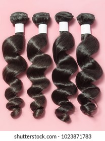 Spiral loose wavy black human hair weaves extensions bundles - Shutterstock ID 1023871783