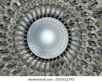 Spiral of metal winding upwards towards the light. - Powered by Shutterstock