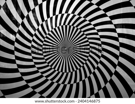Spiral optical illusion with black and white stripes. Circles within a circle.