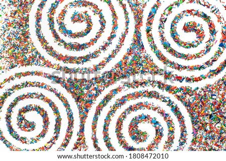 Spiral pattern. Helix and scroll, gyre, curl, loop symbol. Flat lay on white background. made from coloring pencils debris or flakes