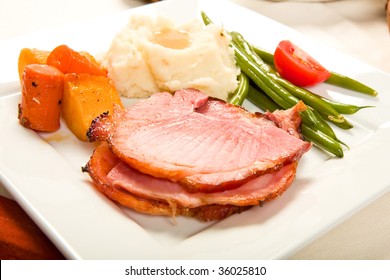 Spiral Sliced Ham On Plate With Vegetables