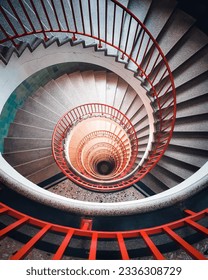 A spiral staircase shot from above.