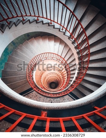 A spiral staircase shot from above.