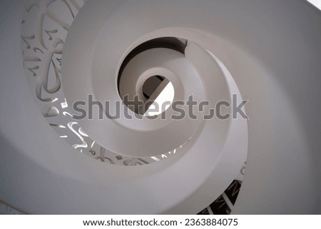 Spiral staircase shot from the bottom, looking up. Museum of the future in Dubai, UAE.