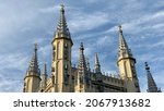 Spire of the Church in the medieval Gothic style. Gothic chapel. Top of the towers.