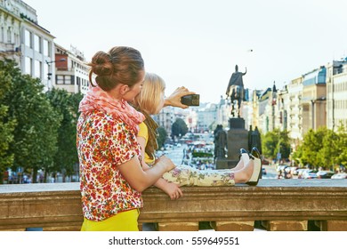 The Spirit Of Old Europe In Prague. Seen From Behind Modern Mother And Child Tourists In Prague, Czech Republic With Digital Camera Taking Photo