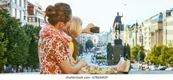 The Spirit Of Old Europe In Prague. Seen From Behind Modern Mother And Child Tourists In Prague, Czech Republic With Digital Camera Taking Photo