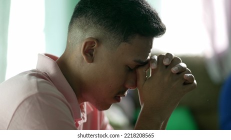 A Spiritual Hispanic Man Praying To God For Better Times. Faithful South American Person In Meditation Hoping