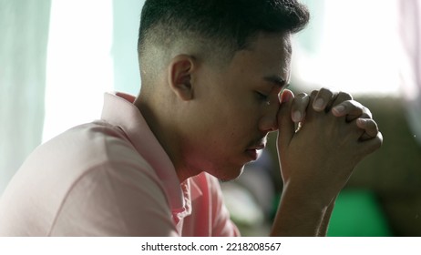 A Spiritual Hispanic Man Praying To God For Better Times. Faithful South American Person In Meditation Hoping